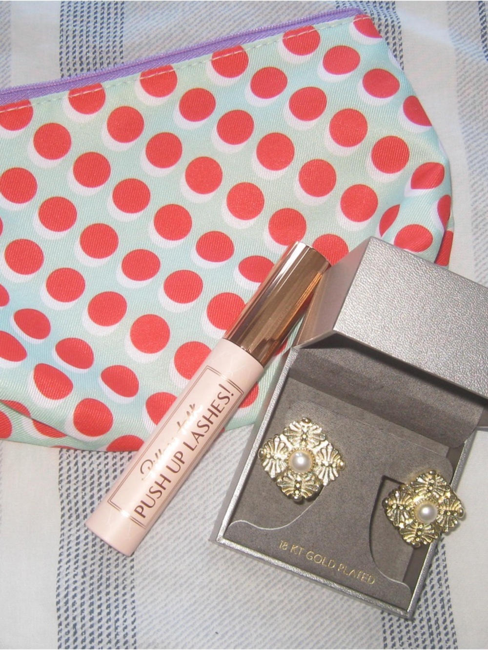 Charlotte Tilbury Mascara, Lussoro Earrings, Clinique Makeup Bag